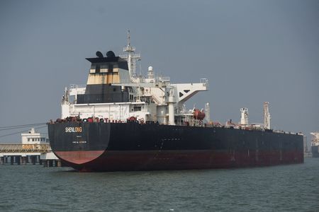 The Liberia-flagged tanker Shenlong Suezmax, loaded with Saudi Arabian crude, arrives at a port after transiting the Strait of Hormuz amid supply disruptions linked to the U.S-Israeli conflict with Iran