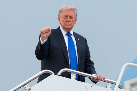 U.S. President Donald Trump boards Air Force One en route to Palm Beach International Airport, at Joint Base Andrews