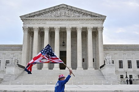 Supporters of those arrested in the January 6, 2021 attack on the U.S. Capitol protest between the U.S. Supreme Court and the Capitol in Washington